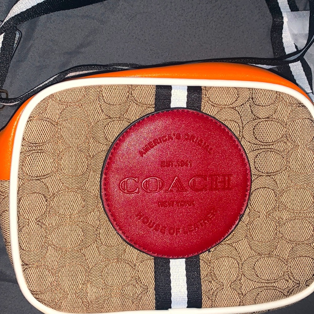 COACH crossbody or side purse. With guitar straps.